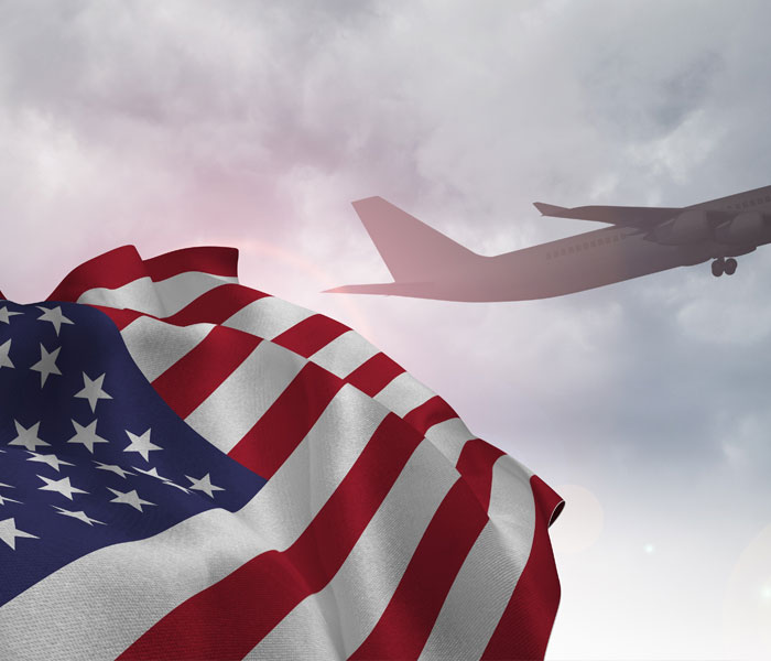 USA flag with aircraft taking off